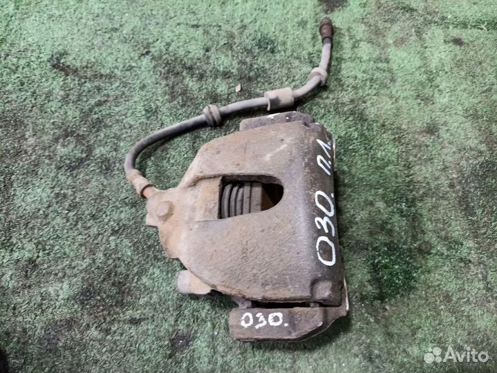 Суппорт тормозной передний левый Ford Focus II (20