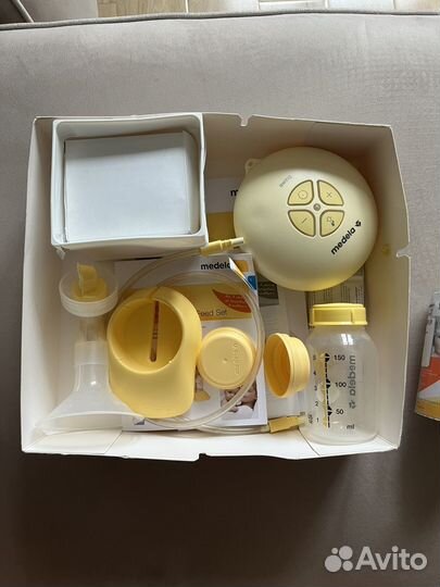 Молокоотсос medela swing электрический