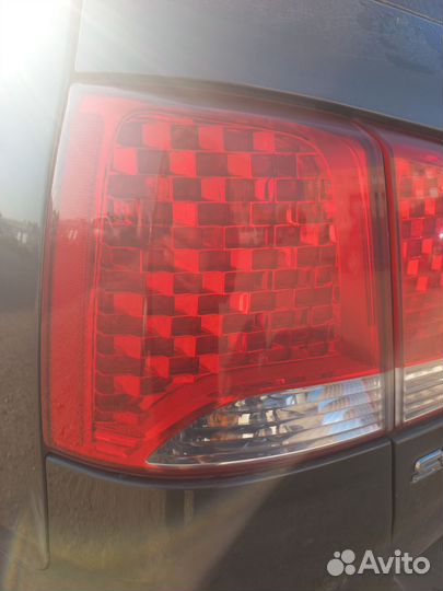 Фонарь левый наружний Kia Sorento 2 XM