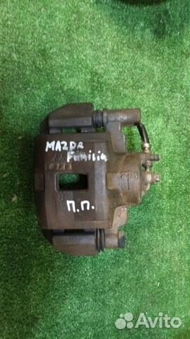 Суппорт тормозной передний правый Mazda Familia BJ