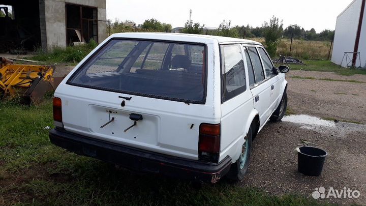 Бампер задний nissan bluebird veu11