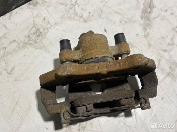 Суппорт тормозной передний левый Renault Sandero