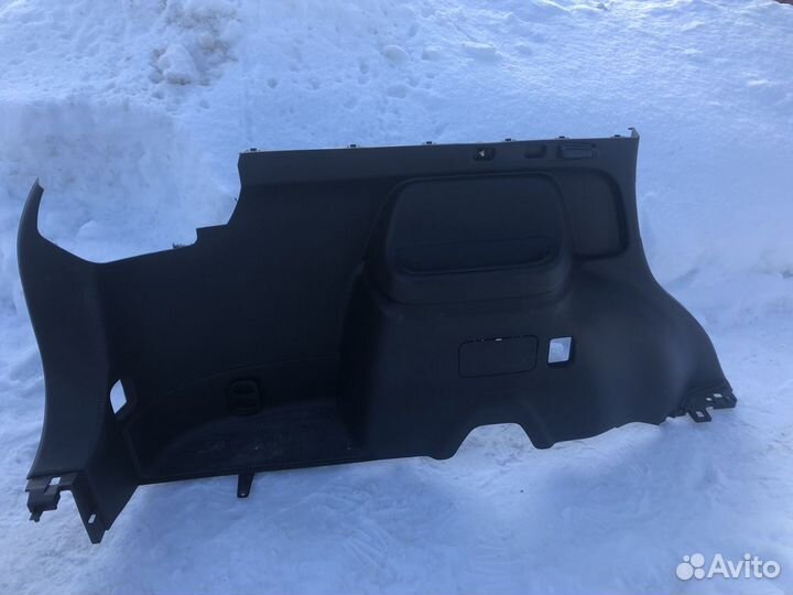 Обшивка левая багажника outlander
