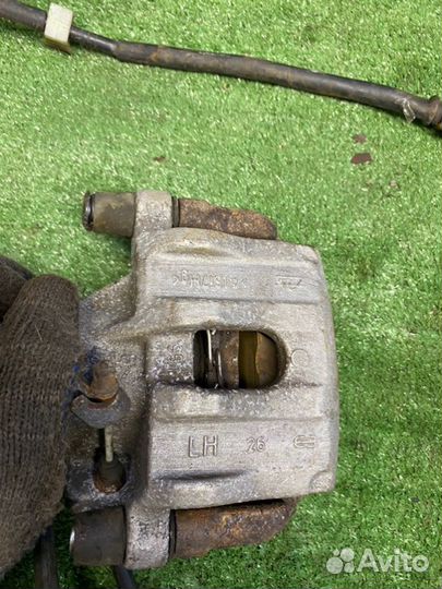 Суппорт тормозной задний левый Mazda 3 BL Z6 2011