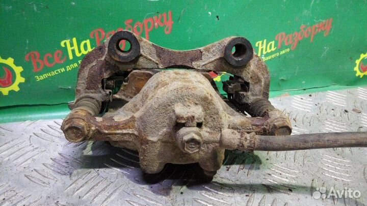 Суппорт передний правый Nissan Sunny седан 1.5