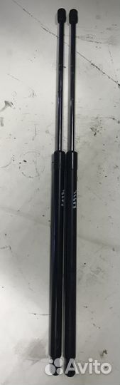 Амортизатор крышки багажника на Кадди