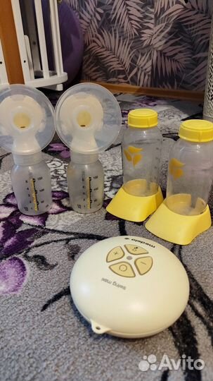 Молокоотсос medela электрический