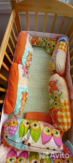 Детская кроватка с маятником