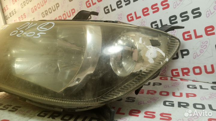 Фара головная DY L не рест б/у (черные очки) Demio