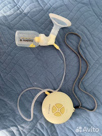 Молокоотсос medela swing