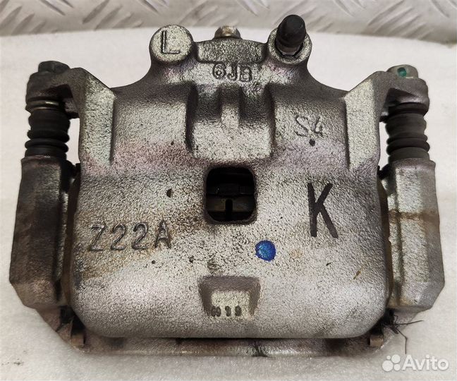 Суппорт тормозной передний левый Nissan Note E