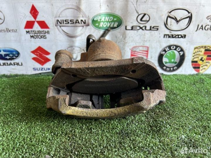 Суппорт тормозной передний левый Ford Escort 5