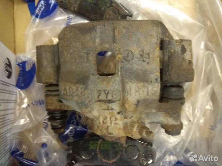 Суппорт тормозной Subaru Forester SF tb /SG