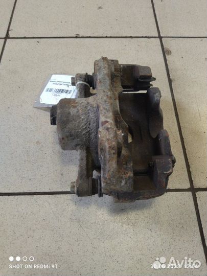 Суппорт тормозной передний правый Skoda Rapid 1