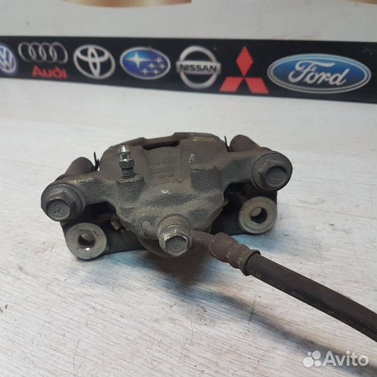 Суппорт тормозной задний левый Nissan Teana J32