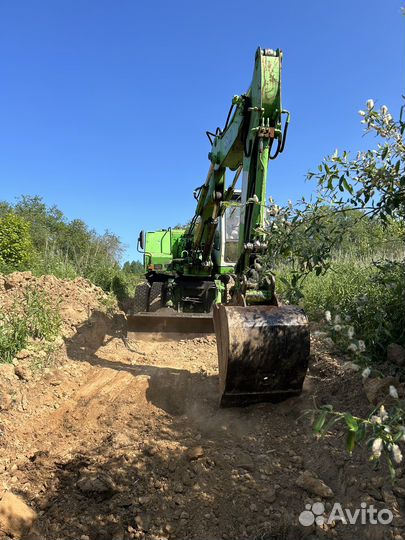 Услуги колесного экскаватора