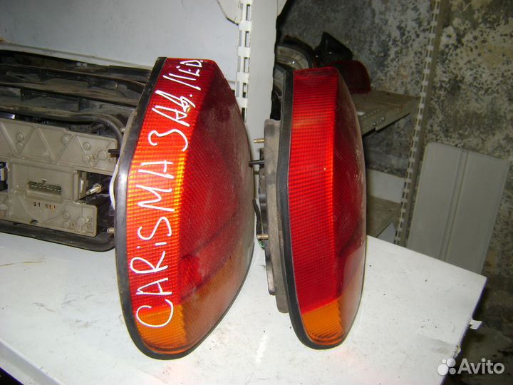 Фонарь левый Митцубиси Каризма Mitsubishi Carisma