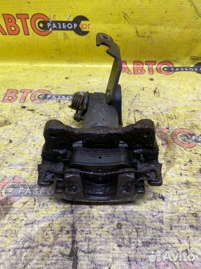 Суппорт задний правый Nissan Primera P12 QG18DE