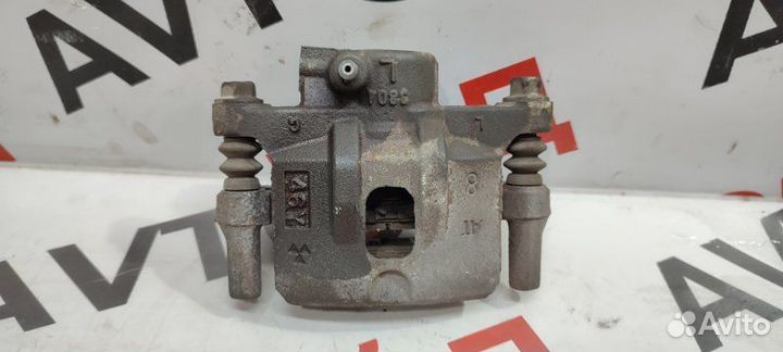 Суппорт тормозной задний левый Mitsubishi Airtrek