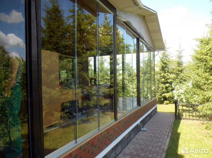 Безрамное остекление домов