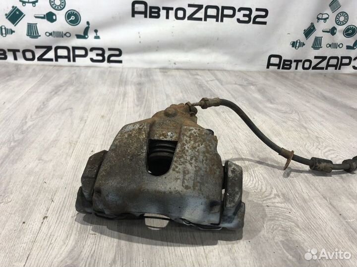 Суппорт тормозной передний левый Ford Focus 3 pnda