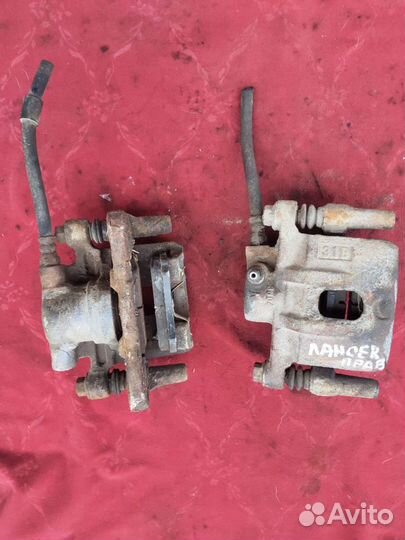 Суппорт задний Митсубиси Лансер 10 правый