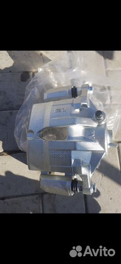 Суппорт тормозной FR KIA Sportage