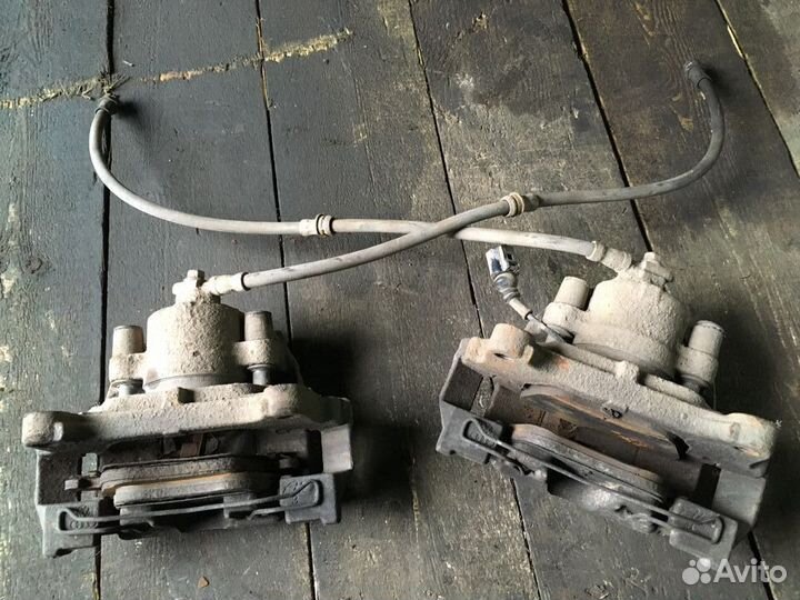 Суппорт тормозной передний левый правый Тигуан 1