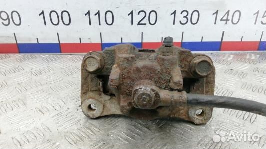 Суппорт тормозной задний левый mitsubishi pajero 4