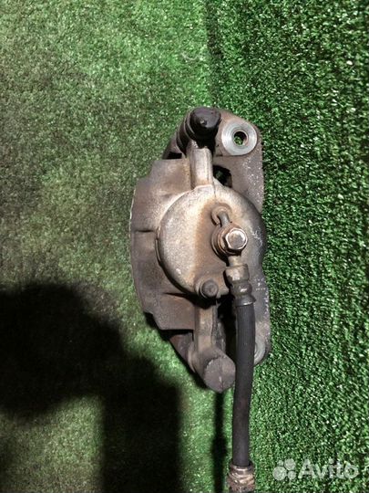 Суппорт тормозной передний левый Mazda Premacy