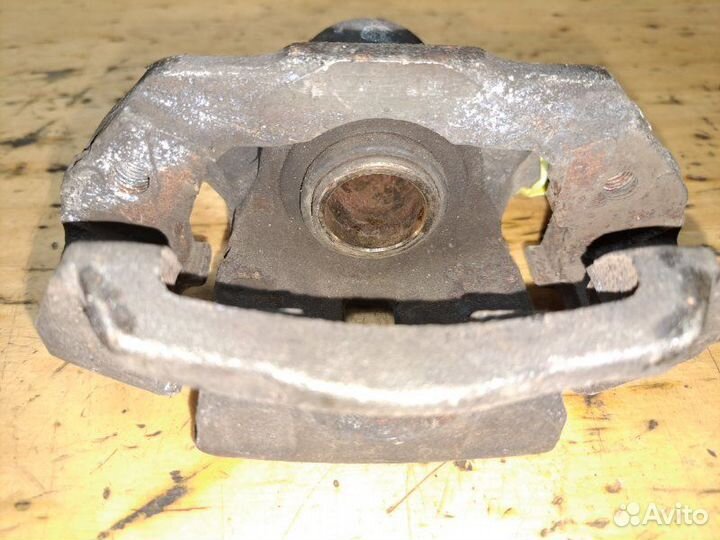 Суппорт задний левый Nissan Laurel HC35 RB20DE