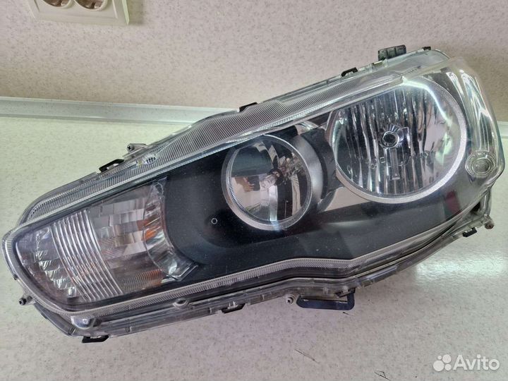 Фара передняя левая на mitsubishi lancer 10
