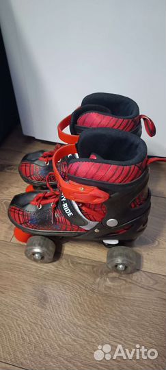 Роликовые регулируемые коньки