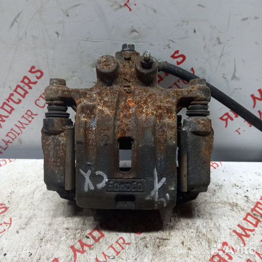 Суппорт тормозной задний правый Mazda Cx7 CBA 2.3