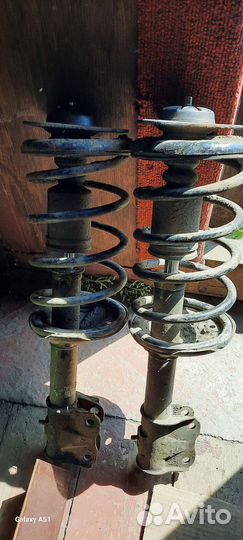 Передние стойки lancer седиа