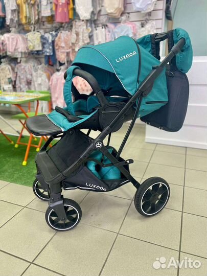 Прогулочная коляска с реверсивным блоком