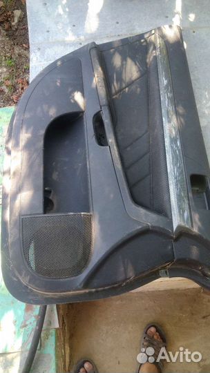 Обшивка двери mitsubishi lancer 10