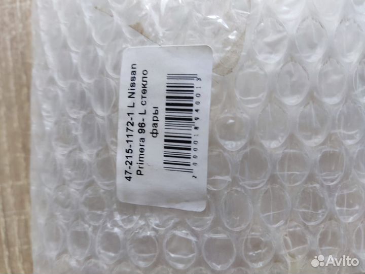 Nissan Primera 96- стекло фары левое 4721511721L