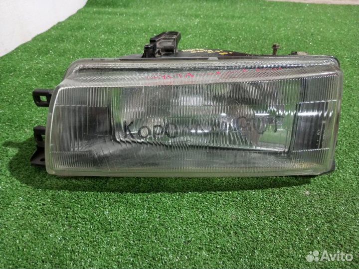 Фара галогеновая левая Toyota Corolla AE91