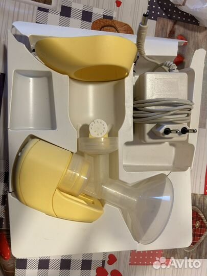 Молокоотсос medela электрический