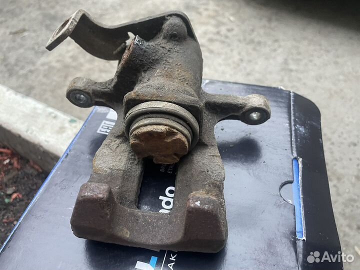 Суппорт тормозной задний solaris