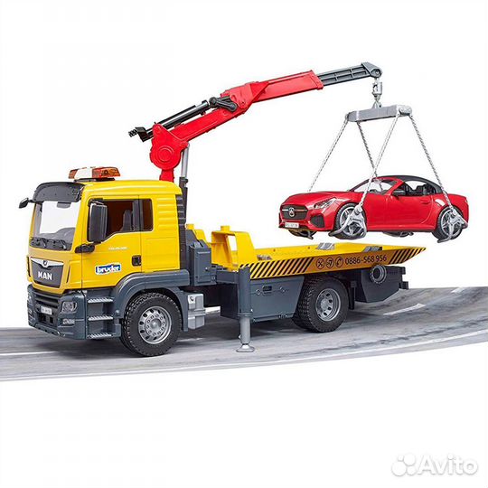 Большой эвакуатор MAN с машинкой Bruder