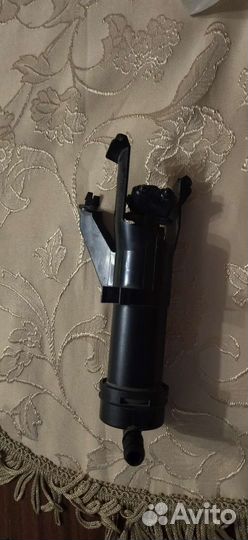 Форсунка омывателя фары Nissan Note e11