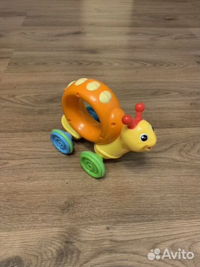 Улитка каталка игрушка механическая