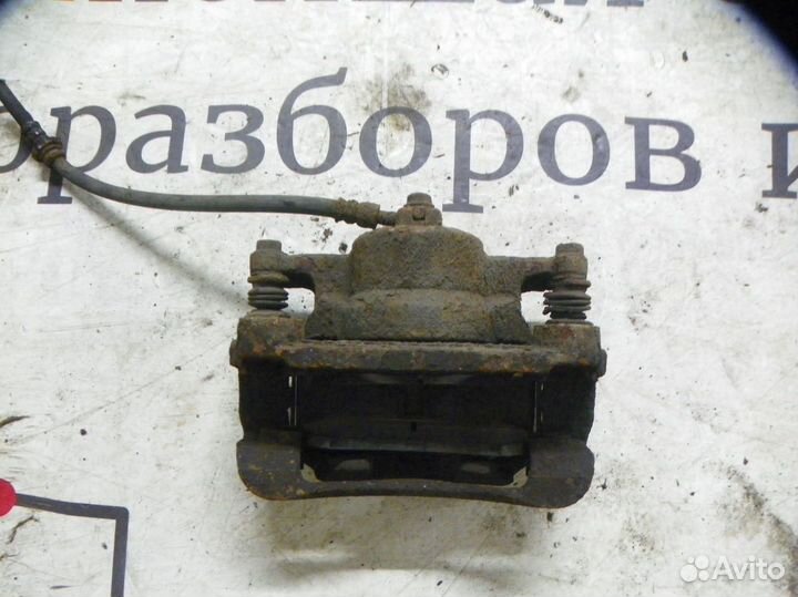 Суппорт тормозной передний левый Nissan Qashqai