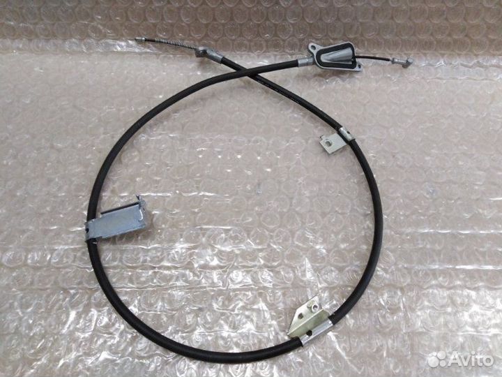 Трос стояночного тормоза задний левый Nissan