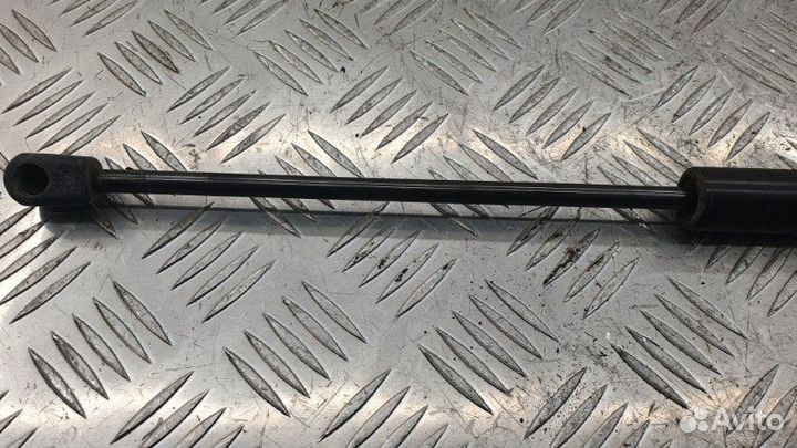 Амортизатор двери багажника задний левый Mazda