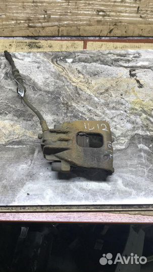 Суппорт тормозной передний левый Ford Focus I (19