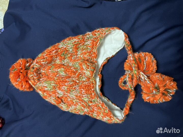 Шапки ушанки с косичками и пумпонами