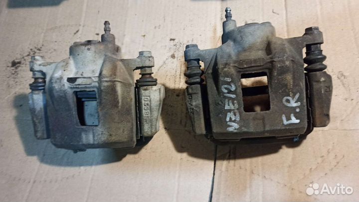 Суппорт тормозной левый Toyota corolla 120